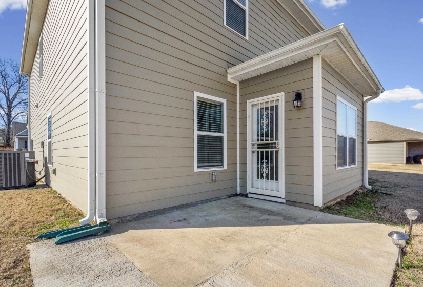 Doorway to property featuring a patio