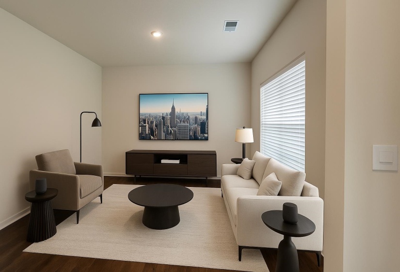 Living area featuring wood finished floors, baseboards, and recessed lighting