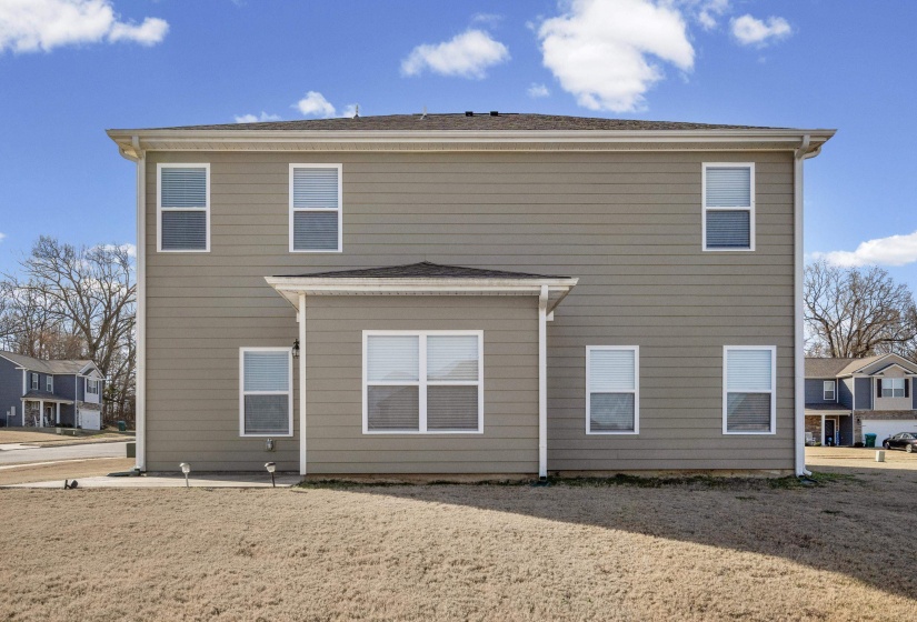 Rear view of house with a shingled roof