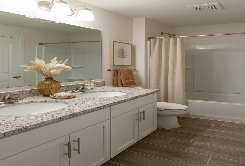Full bath with double vanity, shower / bath combo with shower curtain, toilet, and wood finish floors