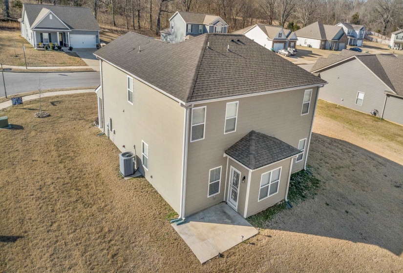 Aerial perspective of suburban area featuring a tree filled landscape