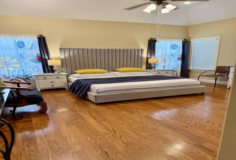 Bedroom with wood-type flooring and ceiling fan
