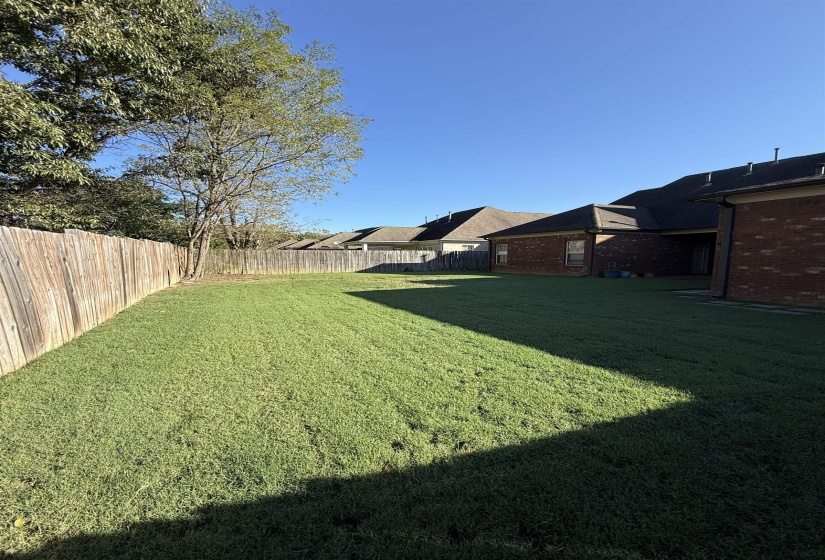 View of fenced backyard