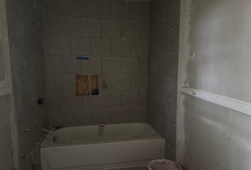 Full bath featuring tub / shower combination