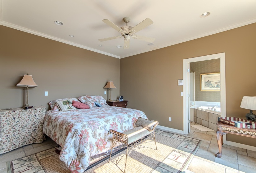 Tiled bedroom featuring crown molding, a ceiling fan, and recessed lighting