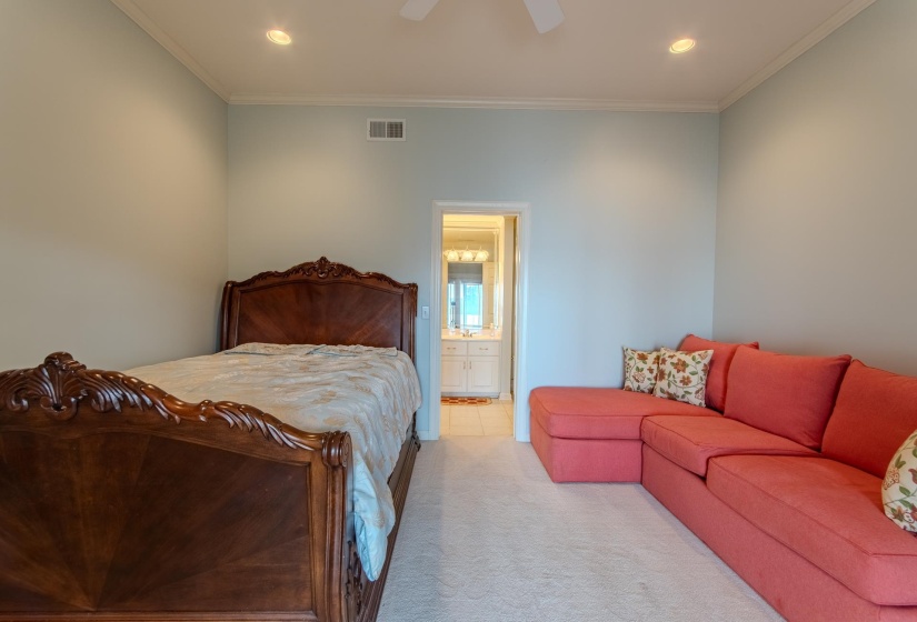 Bedroom with carpet, recessed lighting, crown molding, a ceiling fan, and connected bathroom