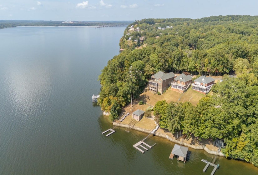 Aerial view of property's location featuring a large body of water