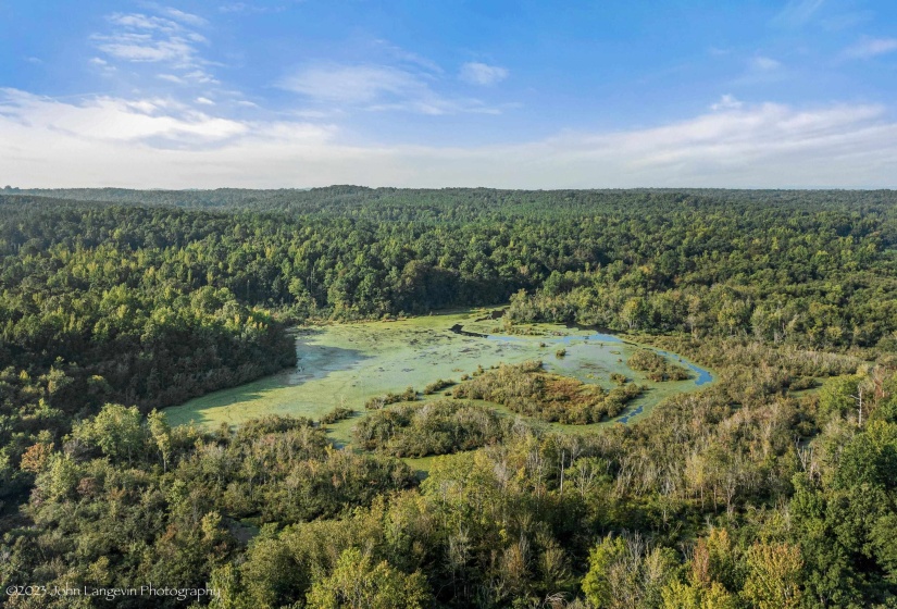 Aerial view of property's location featuring a nearby body of water