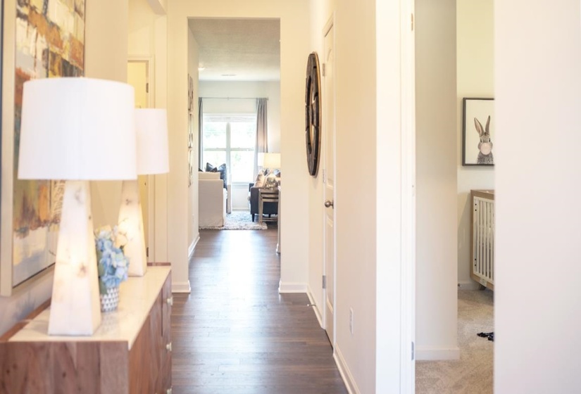 Hall featuring baseboards and dark wood finished floors