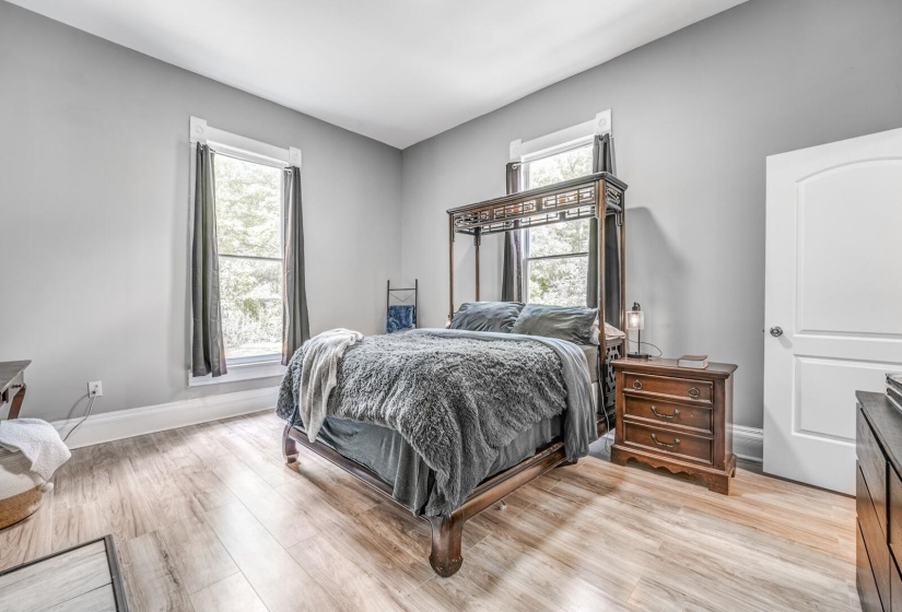 Bedroom featuring light wood-style floors and baseboards