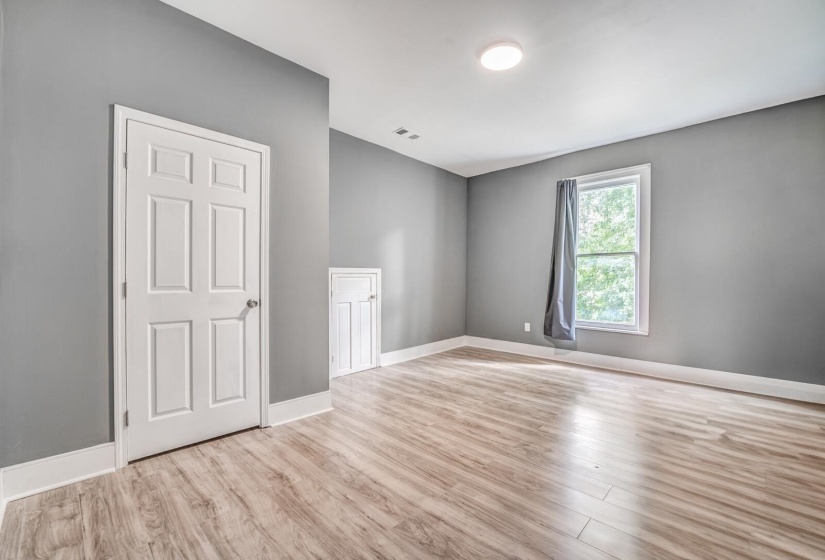 Unfurnished room featuring light wood-type flooring and baseboards