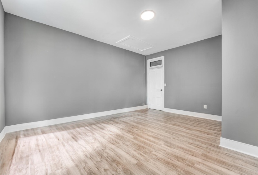 Empty room featuring light wood finished floors and baseboards