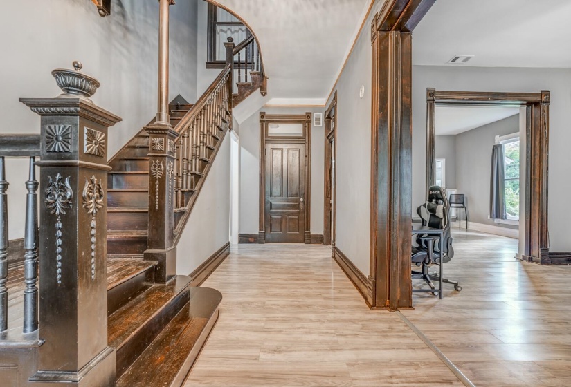 Foyer entrance with light wood-style flooring and stairs