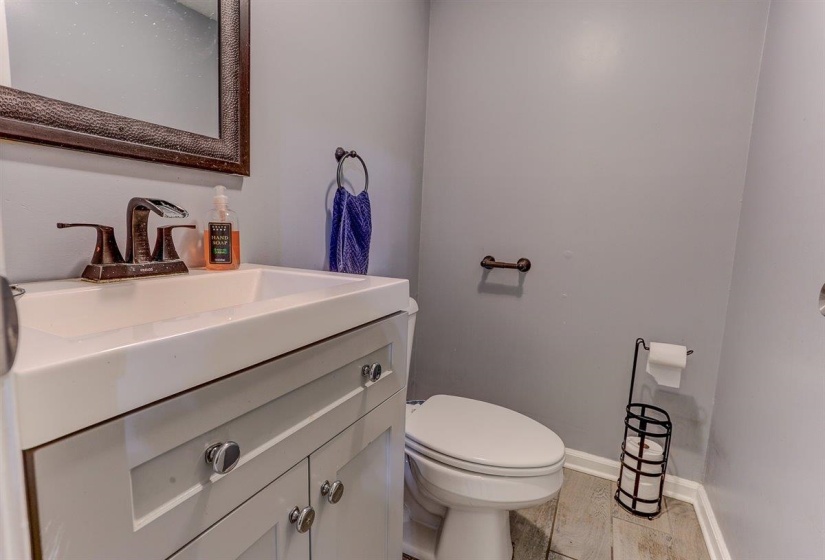 Bathroom featuring vanity and baseboards