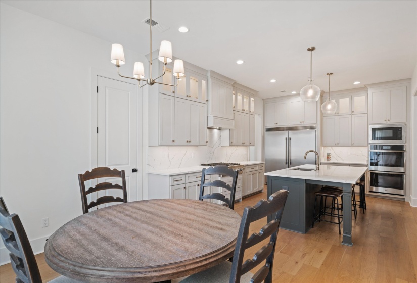Breakfast space featuring light wood-style flooring, recessed lighting, and a chandelier