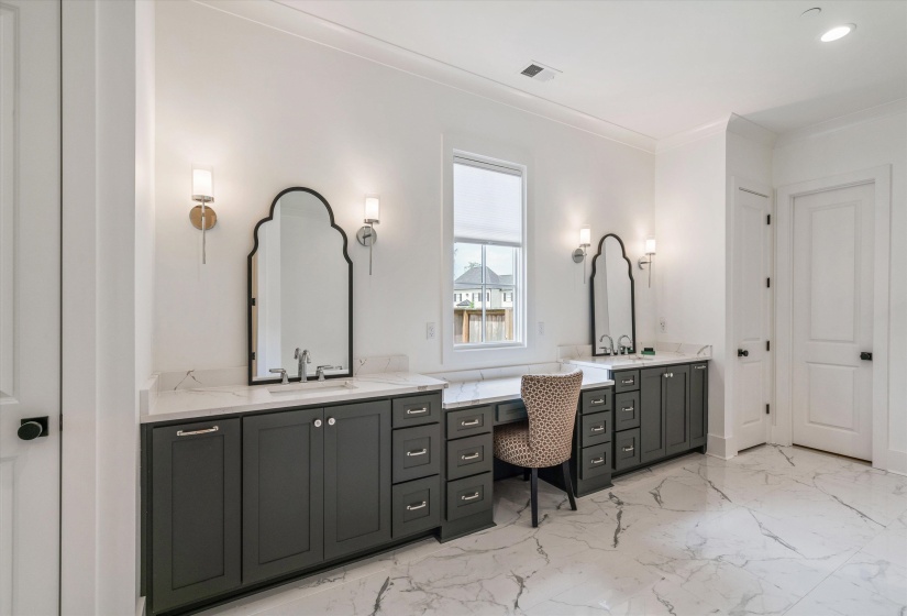 Bathroom with vanity, light marble finish floors, recessed lighting, and crown molding