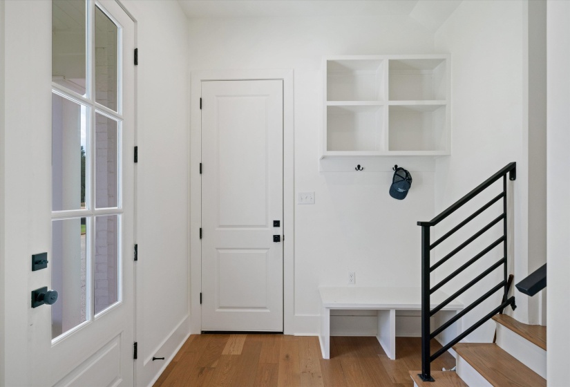 Entry from driveway. Rear stairs to upper level