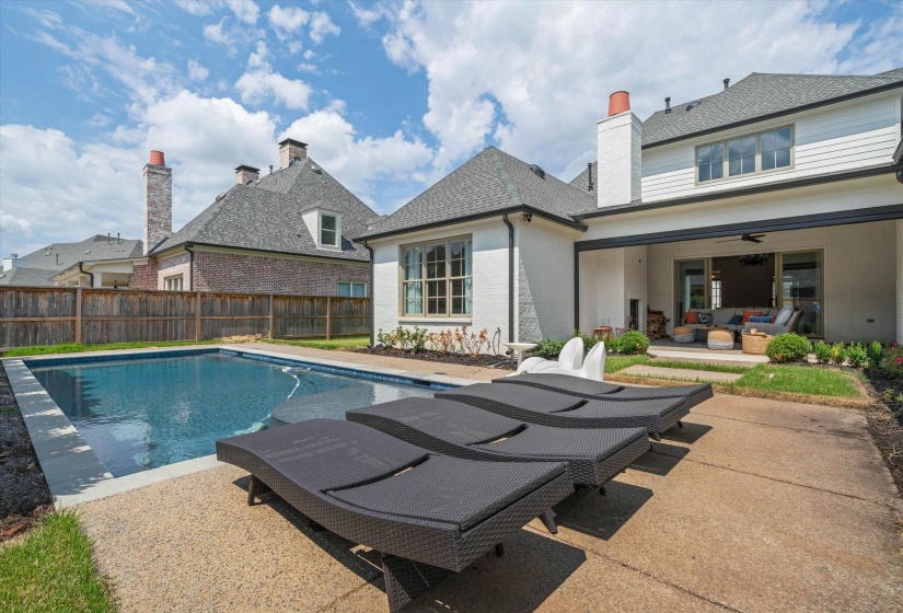 View of pool with a ceiling fan, a patio, a fenced backyard, and an outdoor hangout area