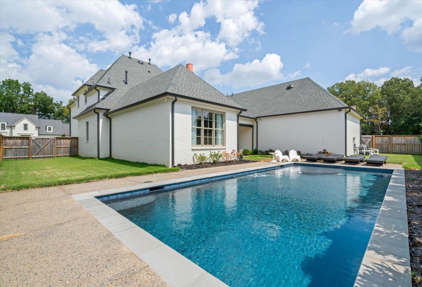 View of pool featuring a fenced backyard and a patio area