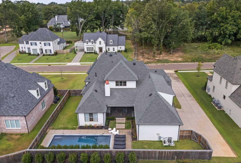 Aerial view of home, pool is on the south side of the lot