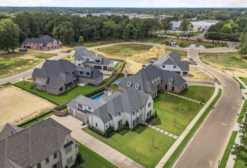 Aerial view of residential area featuring a nearby body of water