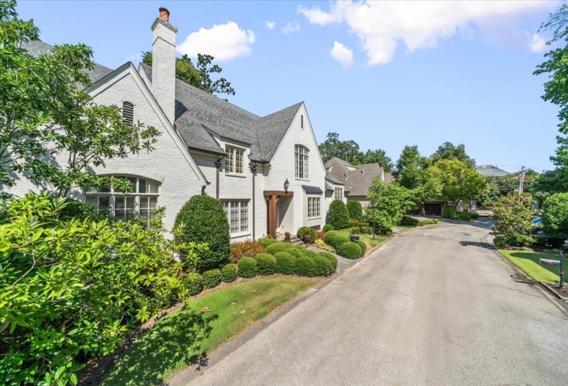 View of property exterior featuring a chimney