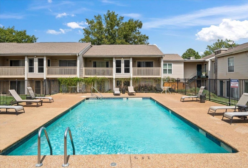 Community pool featuring a patio area