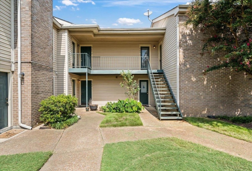 View of property featuring stairway