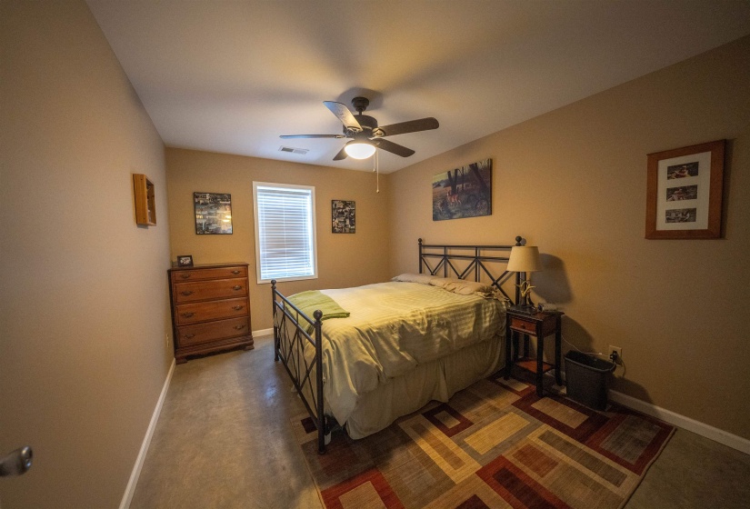 Bedroom featuring baseboards and a ceiling fan