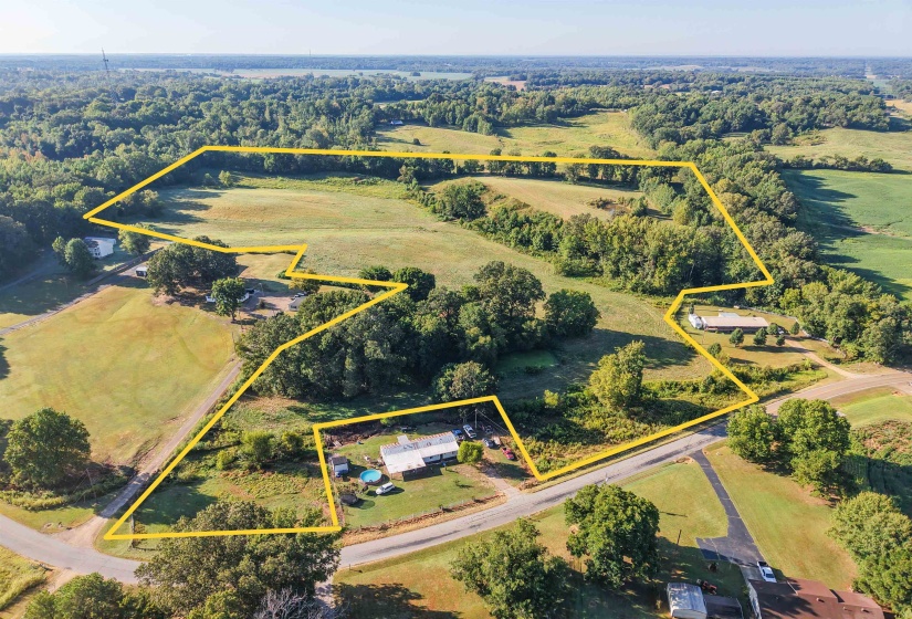 Aerial overview of property's location featuring property parcel outlined