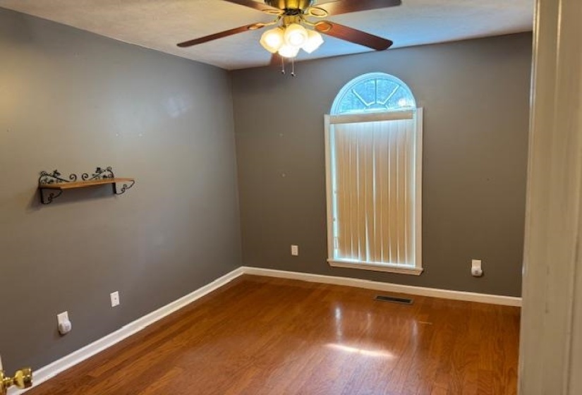Wood-finish flooring complementing neutral wall tones