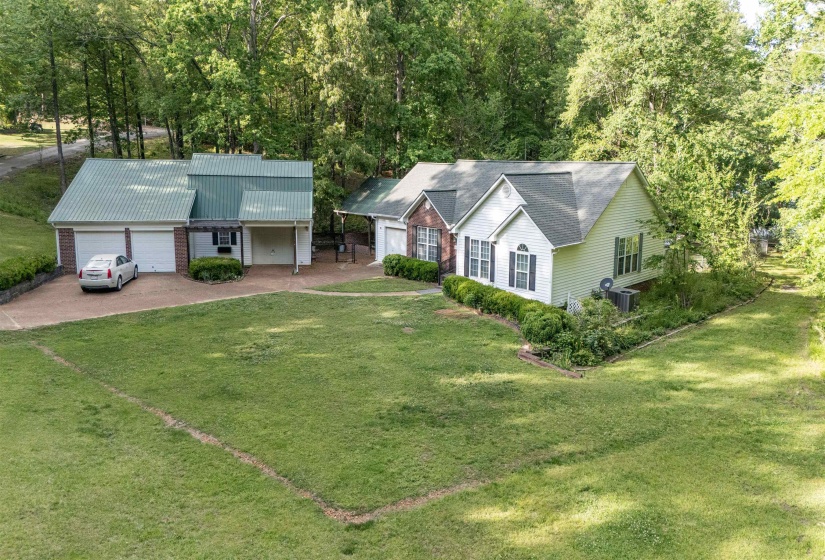 Expansive front lawn with mature perimeter trees