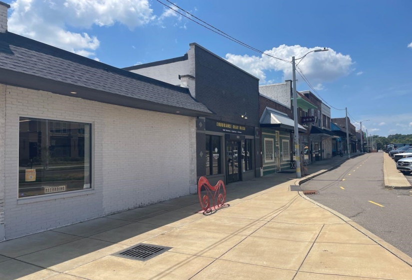 View of road with sidewalks, street lights, and curbs
