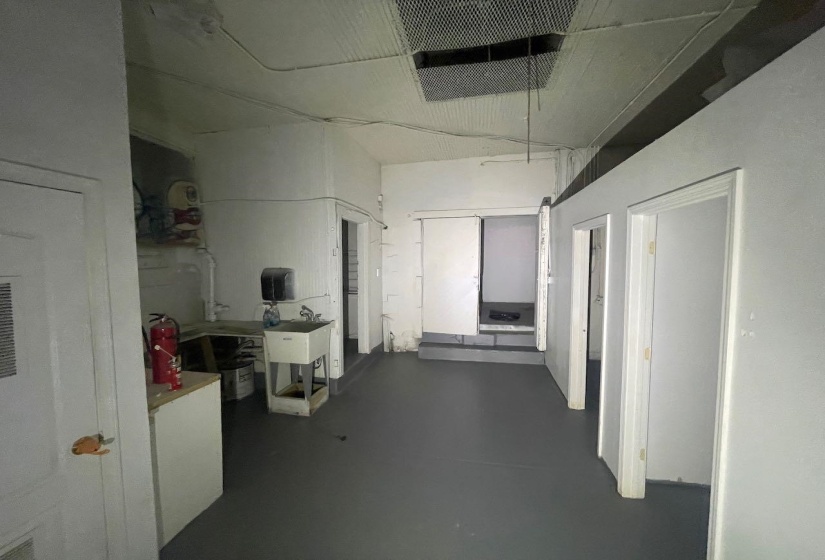 Corridor featuring concrete flooring