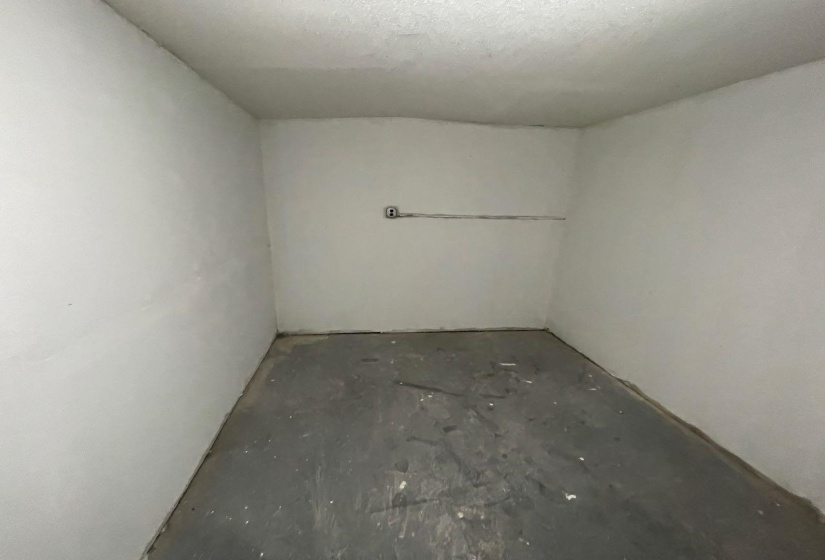 Below grade area with a textured ceiling