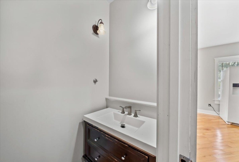 Bathroom with vanity and light wood-style floors