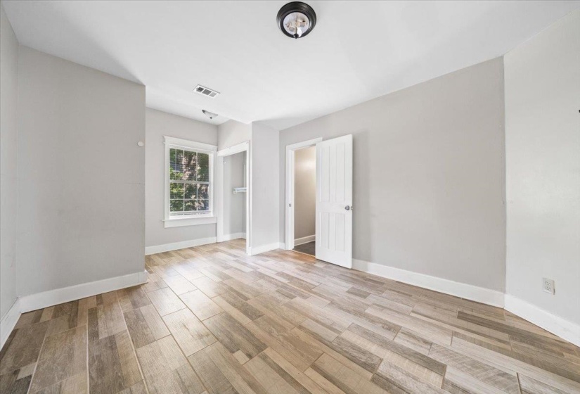 Spare room with light wood finished floors and baseboards
