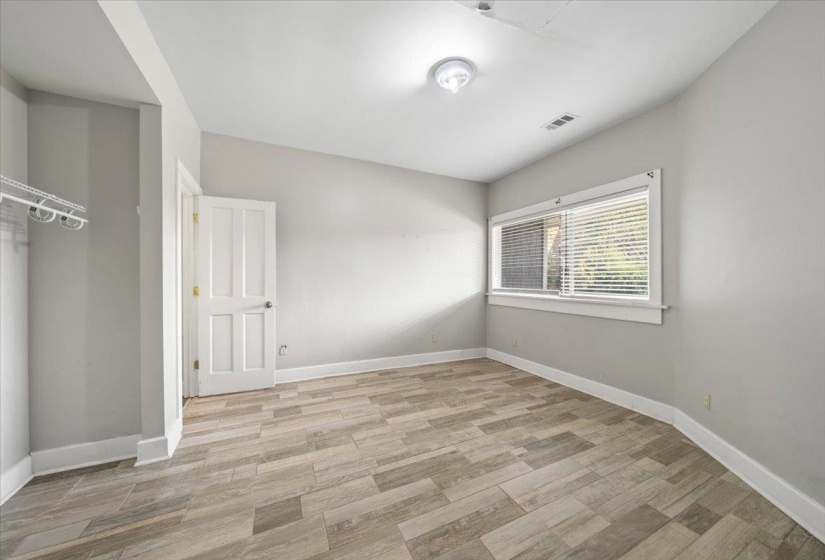 Unfurnished bedroom featuring light wood finished floors