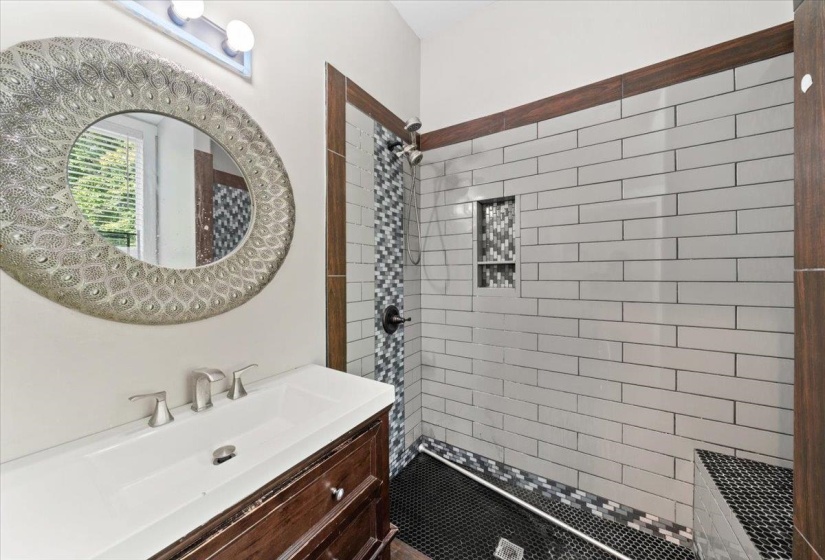 Bathroom with vanity and a shower stall
