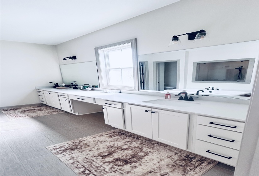 Full bath featuring double vanity