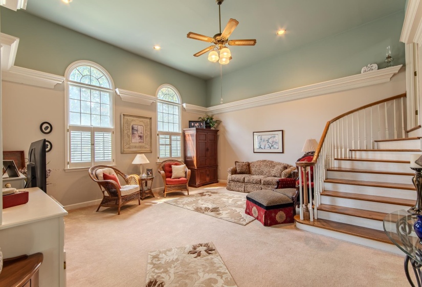 Living room featuring carpet floors, a ceiling fan, stairway, and recessed lighting