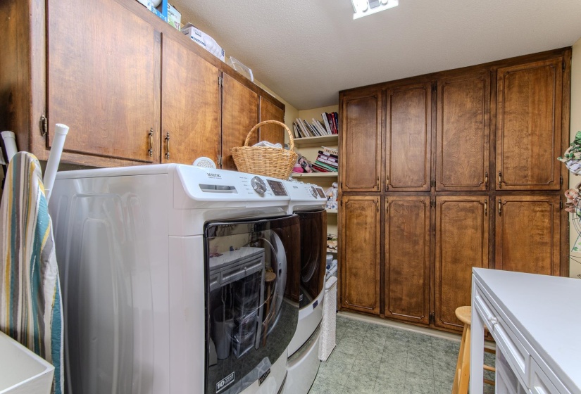 Washroom with cabinet space and separate washer and dryer