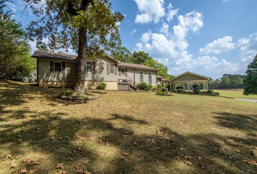 property with a yard and a carport