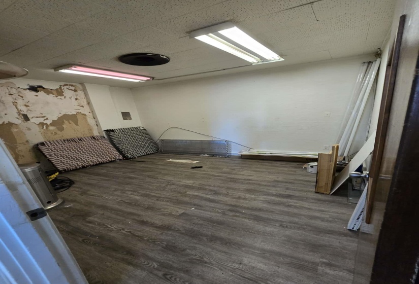 Empty room featuring dark wood-type flooring