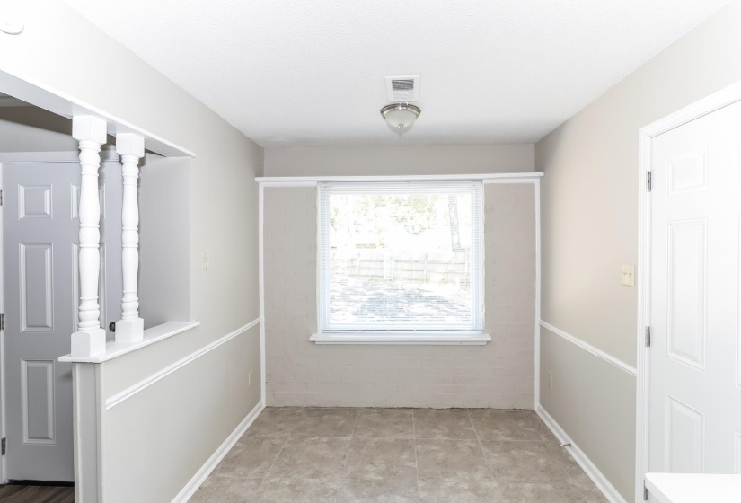 Tiled spare room with baseboards