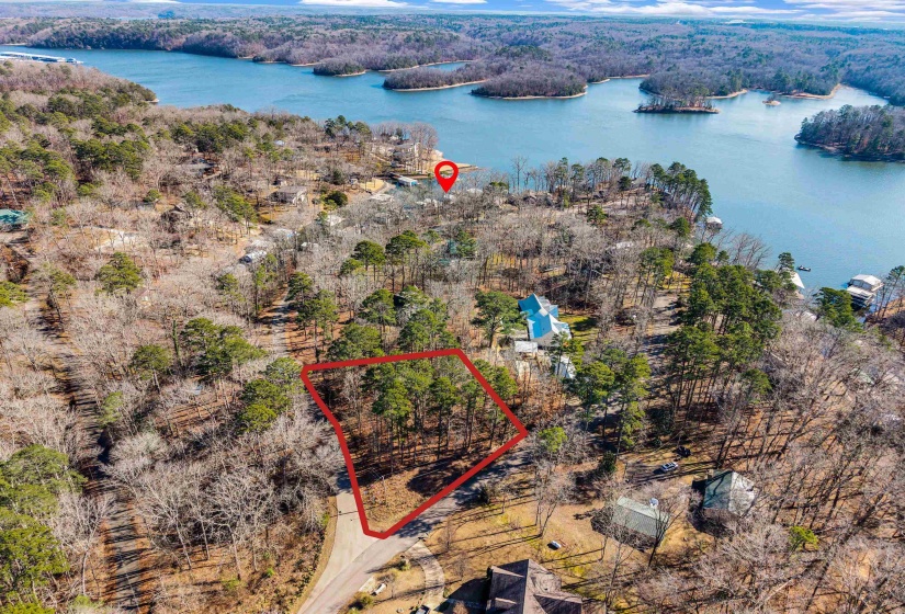 View of property location with property parcel outlined and a nearby body of water