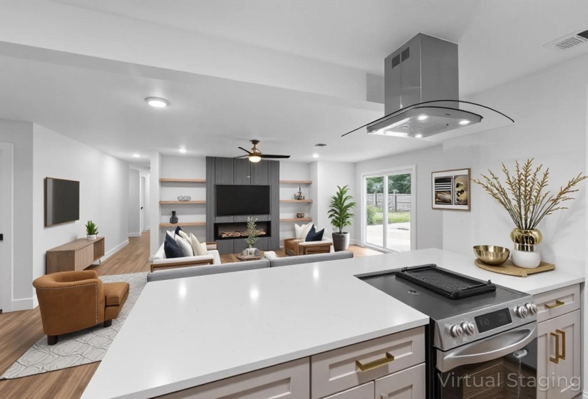 Kitchen featuring electric range, island exhaust hood, light wood-style floors, open floor plan, and a ceiling fan