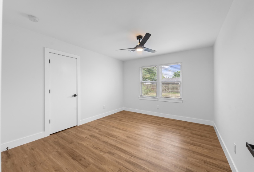 Spare room with light wood-style flooring and a ceiling fan