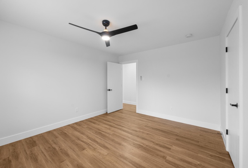 Unfurnished bedroom with light wood-style flooring and ceiling fan