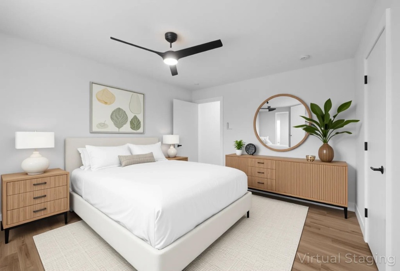 Bedroom featuring light wood finished floors and a ceiling fan